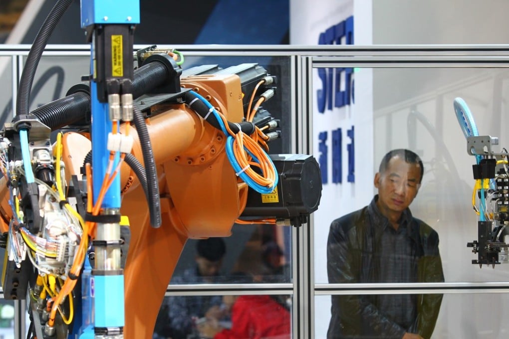 A man looks at an exhibit at last year’s World Robot Conference in Beijing. Photo: Simon Song