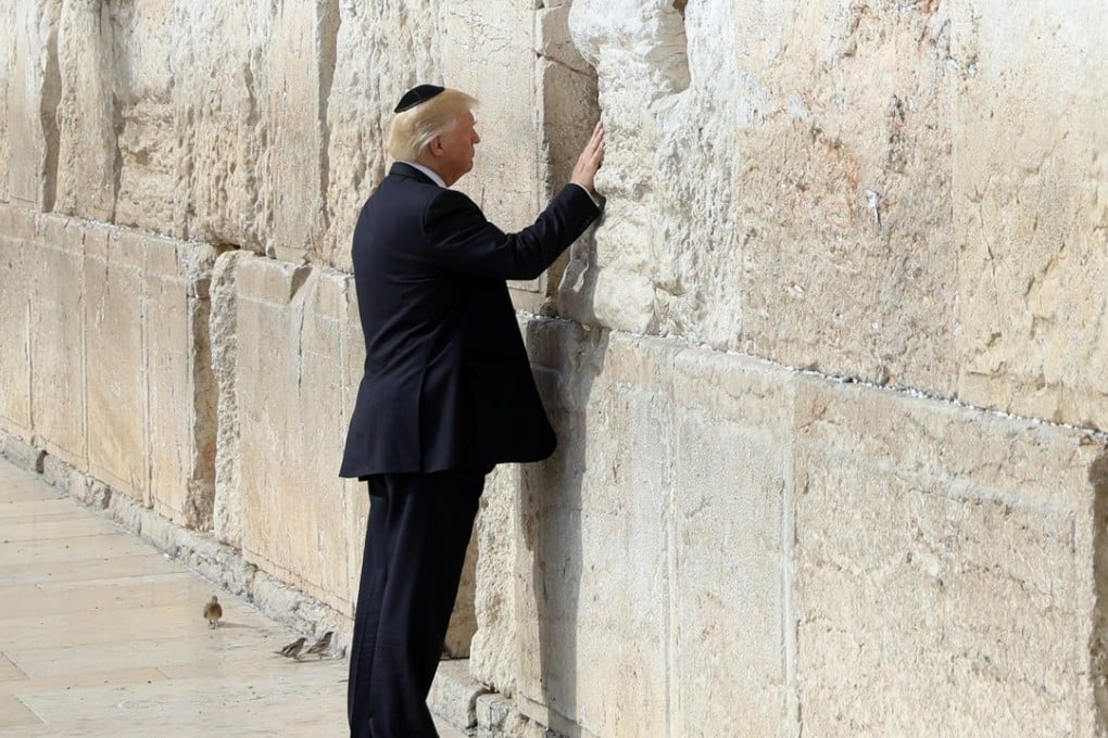 US President Donald Trump touches the Western Wall in Jerusalem’s Old City. Photo: EPA