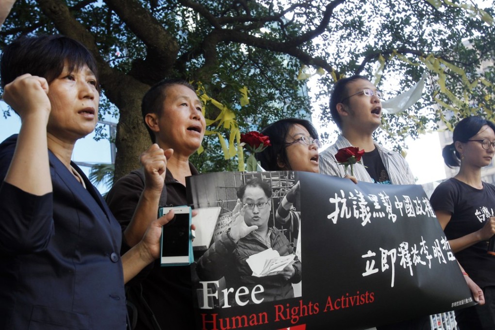 Supporters of Taiwanese activist Lee Ming-che protested against his imprisonment in China for holding online political lectures and helping the families of jailed dissidents. Photo: AP