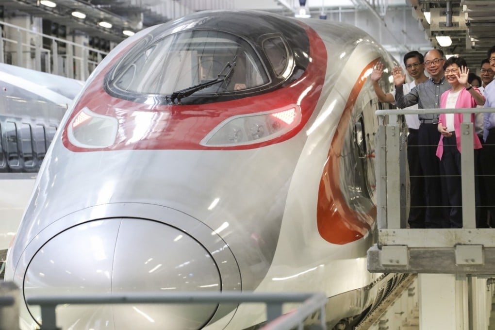 Hong Kong Chief Executive Carrie Lam Cheng Yuet-ngor (in pink) views an express rail link train delivered to Hong Kong. Photo: Felix Wong