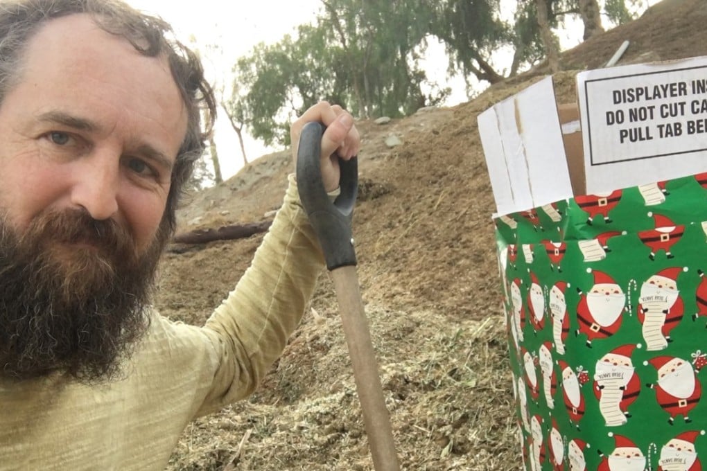 Robert Strong is seen next to a gift-wrapped box. Photo: Reuters