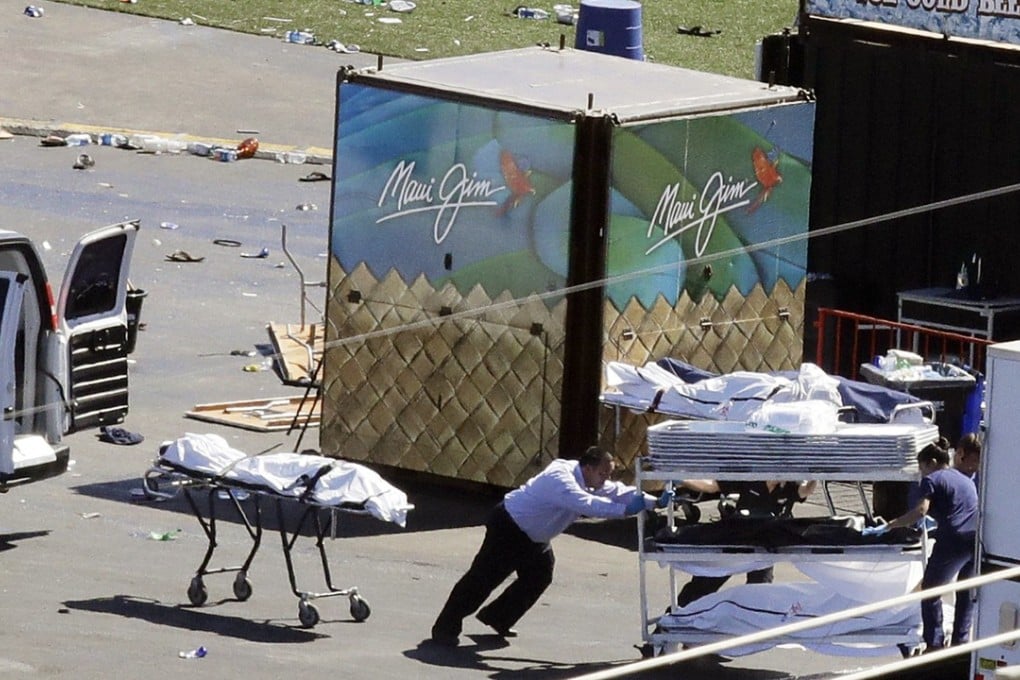In this October 2, 2017 file photo, investigators load bodies from the scene of a mass shooting at the Route 91 Harvest festival near the Mandalay Bay resort and casino in Las Vegas. Easy access to guns has been identified as one reason Americans live, on average, shorter lives than those in other rich countries. Photo: AP