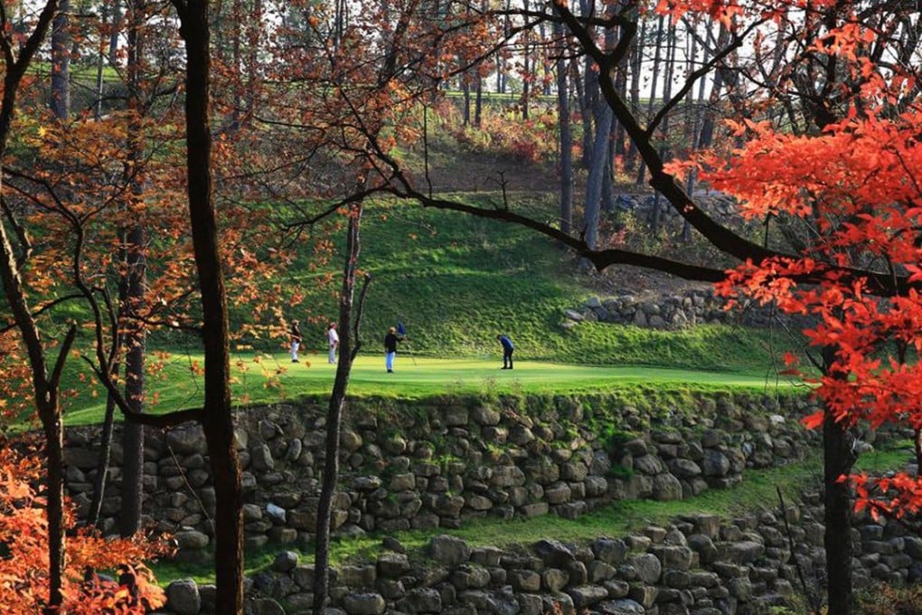 Golfers play one of the holes at the Changbaishan International Resort in Fusong county, Jilin. Photo: Handout