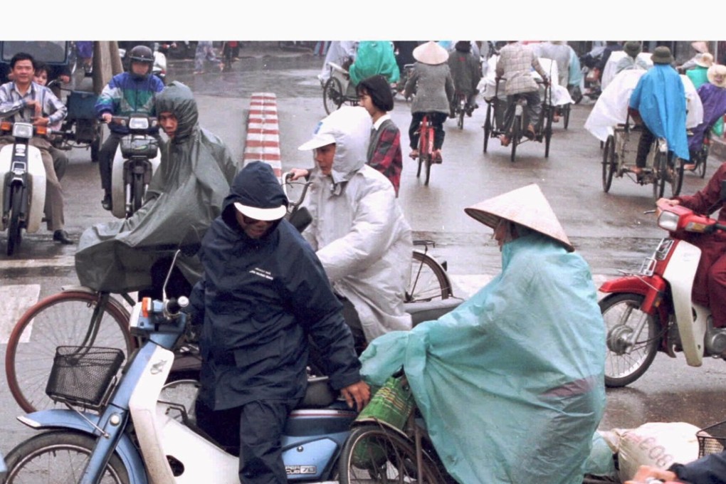 A cyclist skids into a motorbike at a busy intersection in central Hanoi. Vietnam claims that its actions to prevent traffic accidents in increasingly chaotic cities has begun to pay off, with the number of fatalities dropping sharply. Photo: Reuters