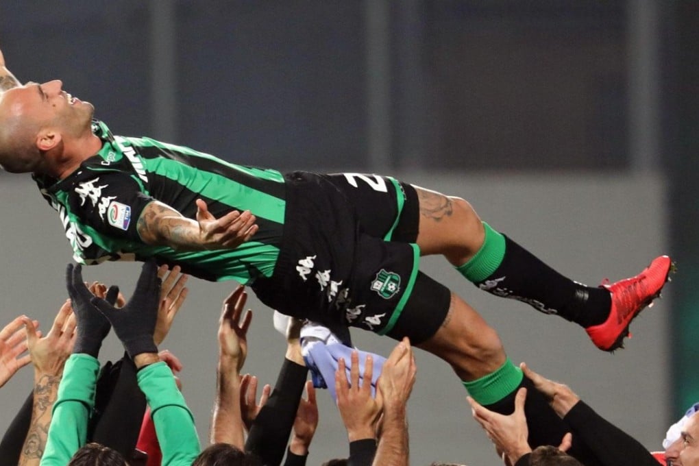Sassuolo players celebrate victory and Paolo Cannavaro’s last home match before he retires. Photo: EPA