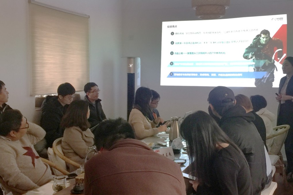 Victoria Yao, the co-founder of Chinese outdoor training start-up Outingman, makes a pitch before investors at a Beijing teahouse run by Jianyihui, a community for private equity firms and angel investors, on December 14, 2017. Photo: Sarah Dai