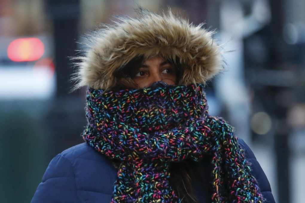 A pedestrian crosses the street on December 27, 2017 in Chicago, Illinois. Frigid temperatures will continue to blast the US as 2018 begins this holiday weekend. Photo: Getty Images/AFP