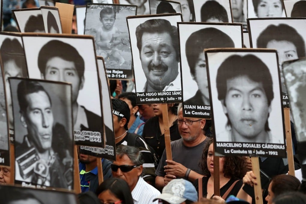 Relatives of victims of Peruvian President Alberto Fujimori’s government protest in Lima on December 28, 2017. Photo: EPA