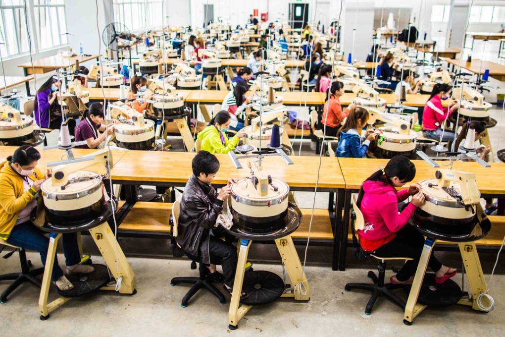 Spinners at Deutsche BekleidungsWerke’s newly opened, fully air-conditioned factory in Vietnam.