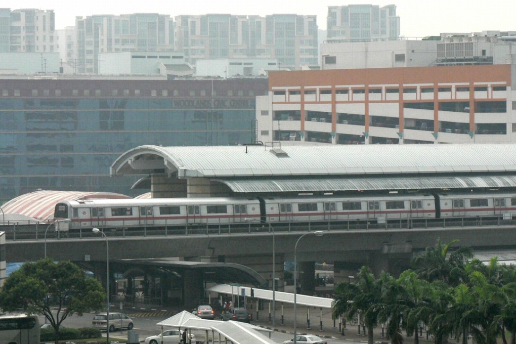File photo of an MRT train leaving a station. Photo: AFP