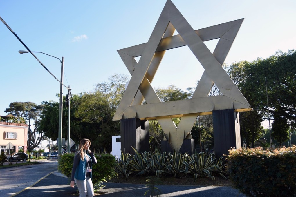 A woman walks across Israel square in Guatemala City on December 27, 2017. Guatemalan President Jimmy Morales announced on Christmas Eve the Central American country would move its embassy in Israel to Jerusalem, mimicking the US’s similar announcement. Photo: AFP