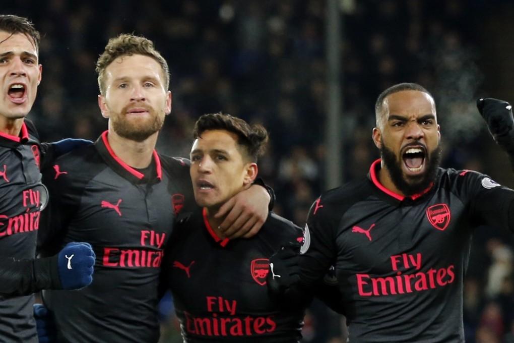 Alexis Sanchez (second right) celebrates with teammates after scoring Arsenal’s second goal during their 3-2 win over Crystal Palace at Selhurst Park. Photo: AP