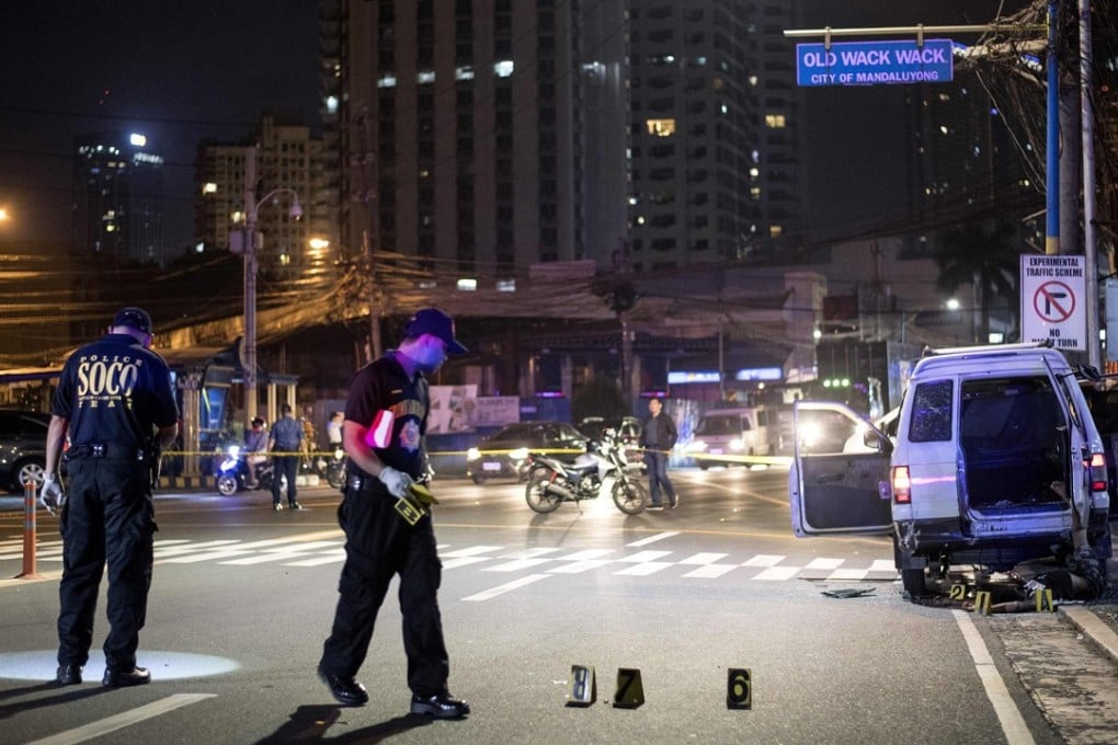 Police investigate the crime scene in Manila. Photo: AFP