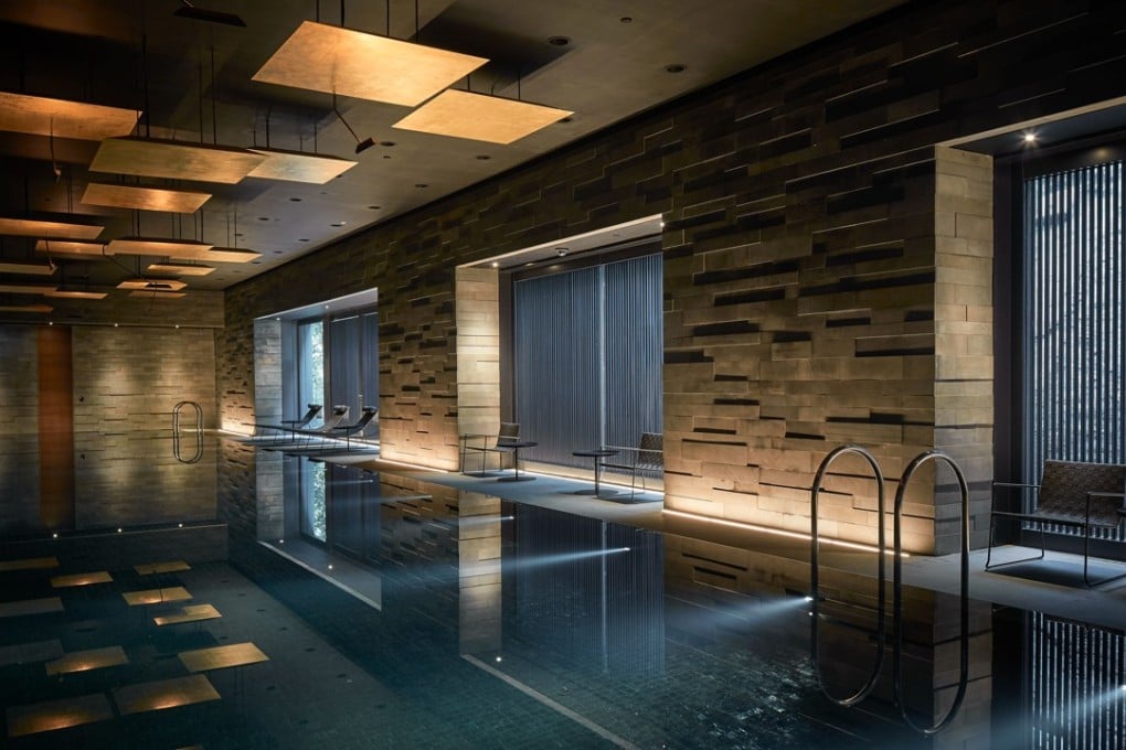 Interior designer Koichiro Ikebuchi designed a swimming pool inspired by Japan’s onsen for the clubhouse of the Pavilia Hill residential development in Tin Hau, Hong Kong.