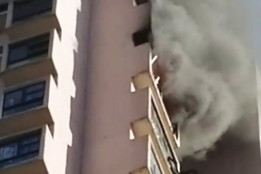 Thick smoke billows from a 21st-floor unit at Wah Fung Garden on Lai King Hill Road. Photo: Facebook