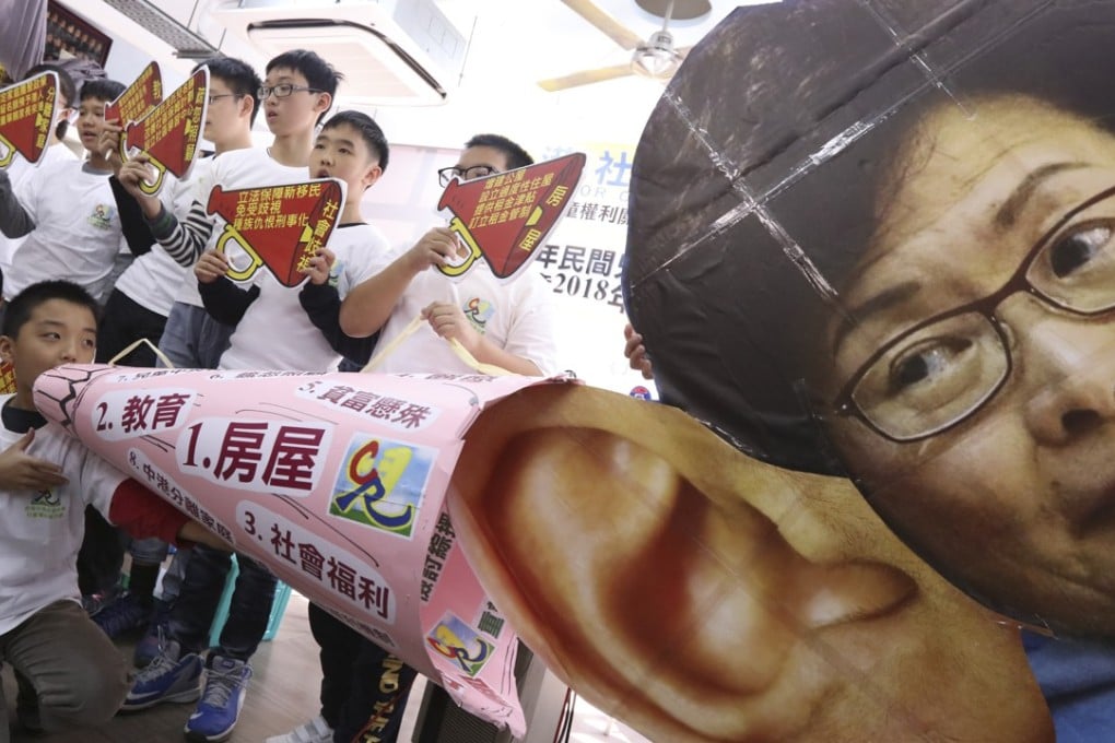 Children make their voices heard in front of a picture of Hong Kong leader Carrie Lam at a press conference on the results of the study. Photo: Felix Wong