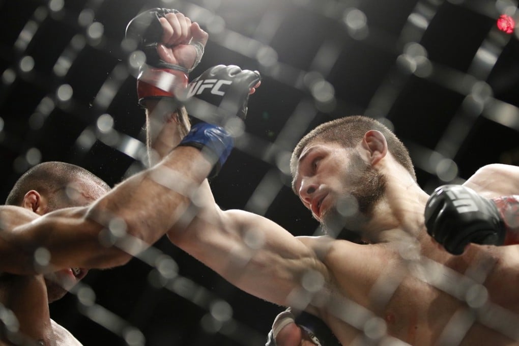 Khabib Nurmagomedov takes a swing at Edson Barboza during a lightweight bout at UFC 219. Photo: AP