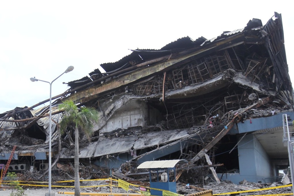 A view of the NCCC shopping centre after it was gutted by fire in Davao. Photo: Reuters