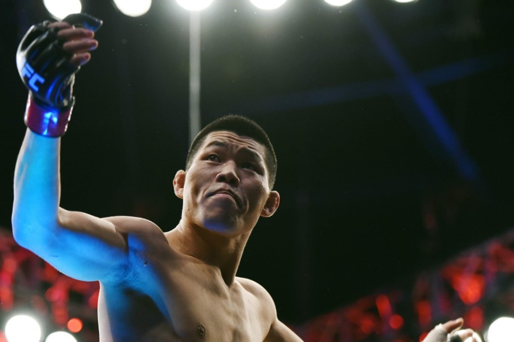 Li Jingliang of China reacts during his UFC men's welterweight event against Zak Ottow of the US at the UFC Fight Night in Shanghai. Photo: AFP