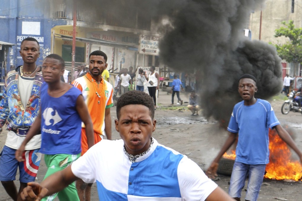 Congolese boys take part in a protest against President Joseph Kabila's refusal to step down from power in Kinshasa, Democratic Republic of Congo. Photo: AP