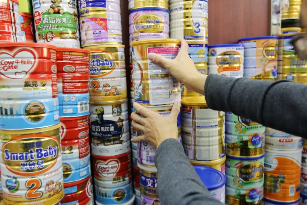 Tins of infant formula are displayed at a pharmacy in Sheung Shui. Photo: Sam Tsang