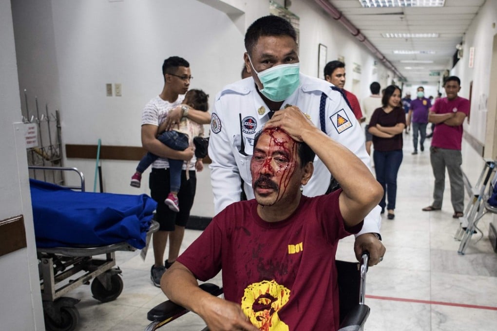 A man injured by firecrackers being assisted at the Jose Reyes Memorial Medical Centre in Manila. Photo: AFP