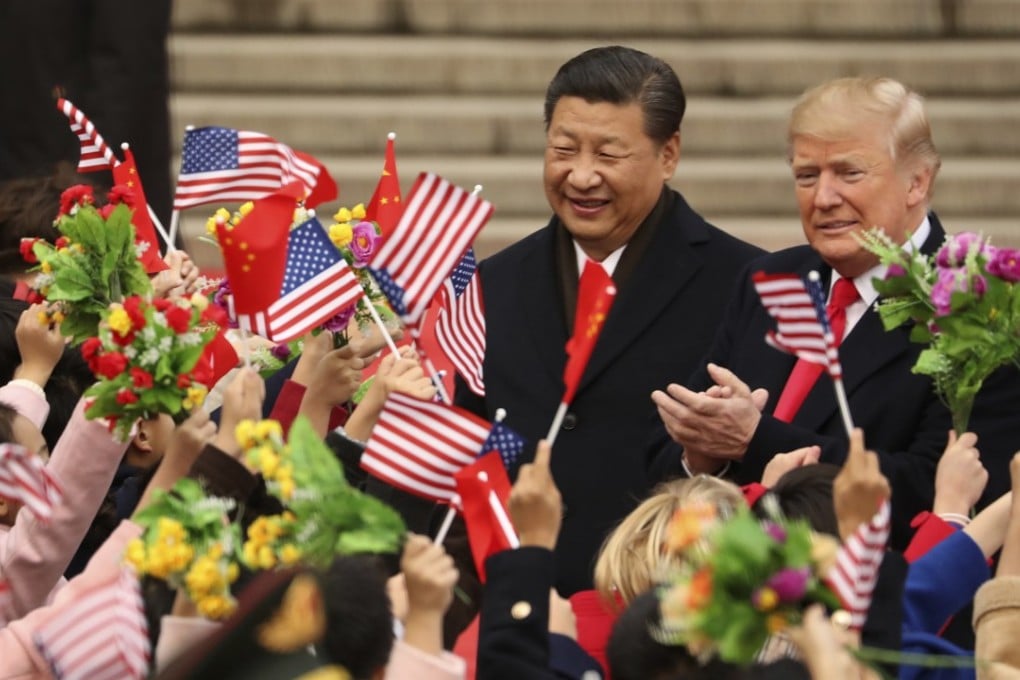 In this November 9, 2017, file photo, President Donald Trump and Chinese President Xi Jinping participate in a welcome ceremony at the Great Hall of the People in Beijing, China. Trump is the first president in decades to close his first year in office without welcoming a counterpart on a state visit to the US. Photo: AP