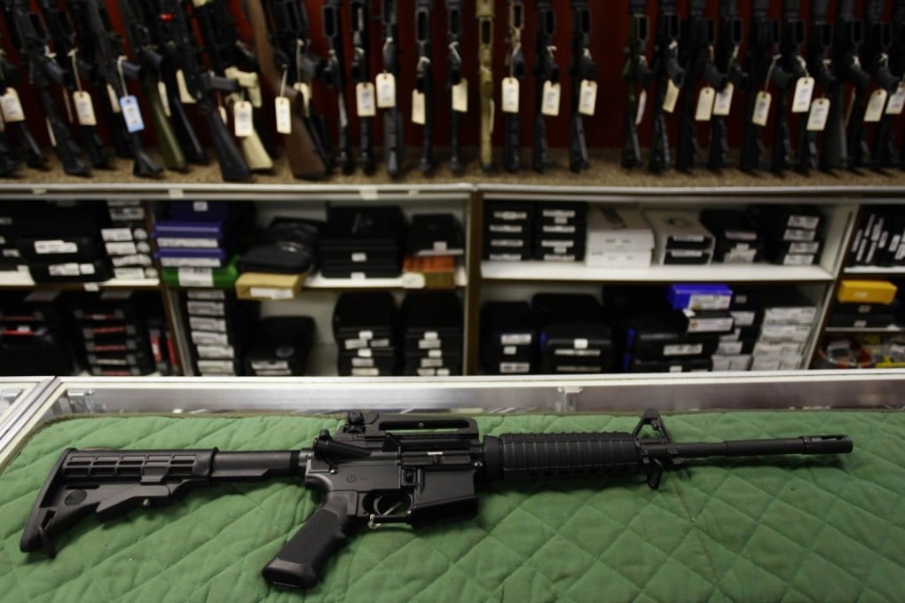 An AR-15 semi-automatic rifle, a shotgun and a handgun, as well as a large quantity of ammunition were found in the Hyatt room of the man arrested. Photo: AFP