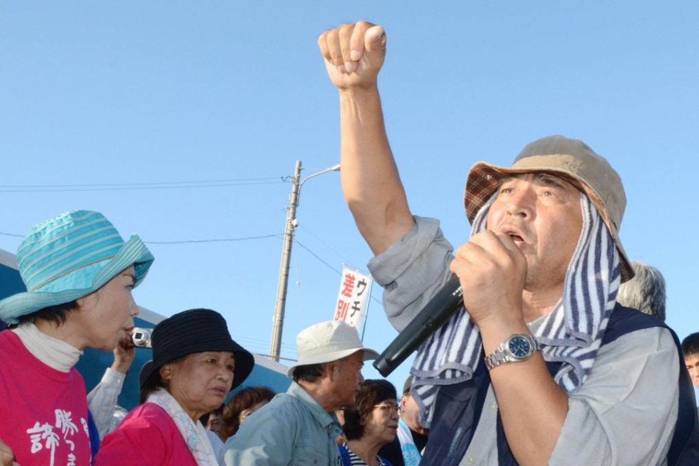 Hiroji Yamashiro rallying protesters outside the US military’s Camp Schwab in Nago, Okinawa. Photo: Kyodo