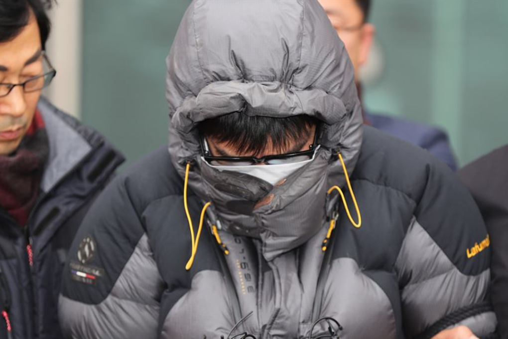 Ko Jun-hee's father, 36, stands in front of Jeonbuk Police Office before being questioned on December 30. The father admitted dumping his daughter's body on a hill in North Jeolla Province in April. Photo: Yonhap