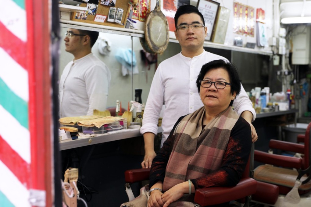 Mark Lau and his mother at Oi Kwan Barber’s in Wan Chai. Photo: Sam Tsang