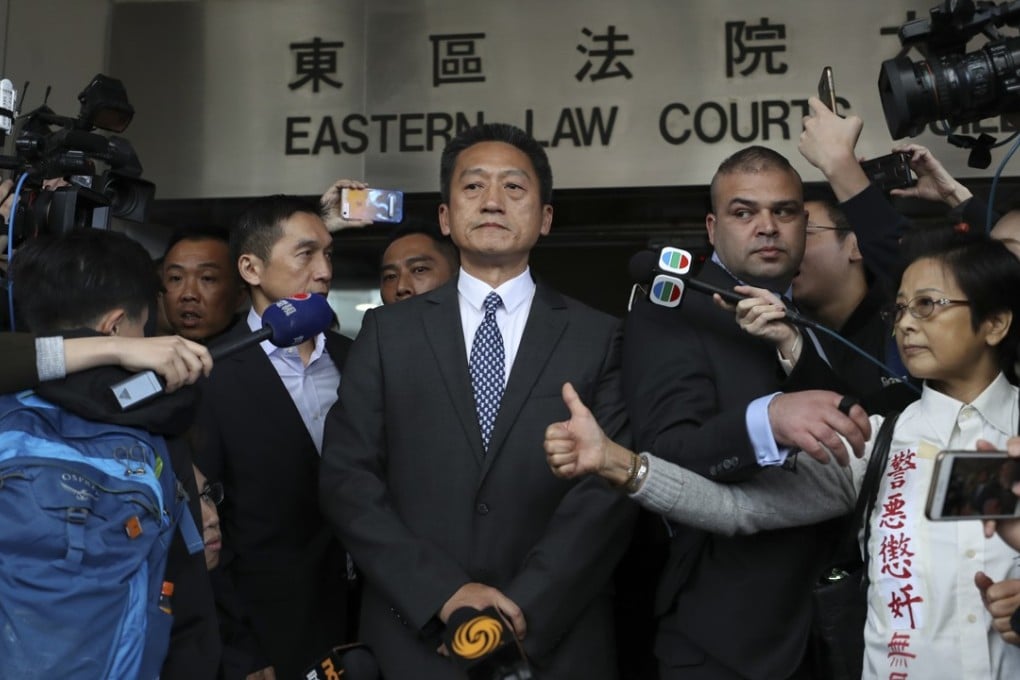 Retired police superintendent Frankly Chu King-wai (centre) leaves the Eastern Court after sentencing. Photo: Winson Wong