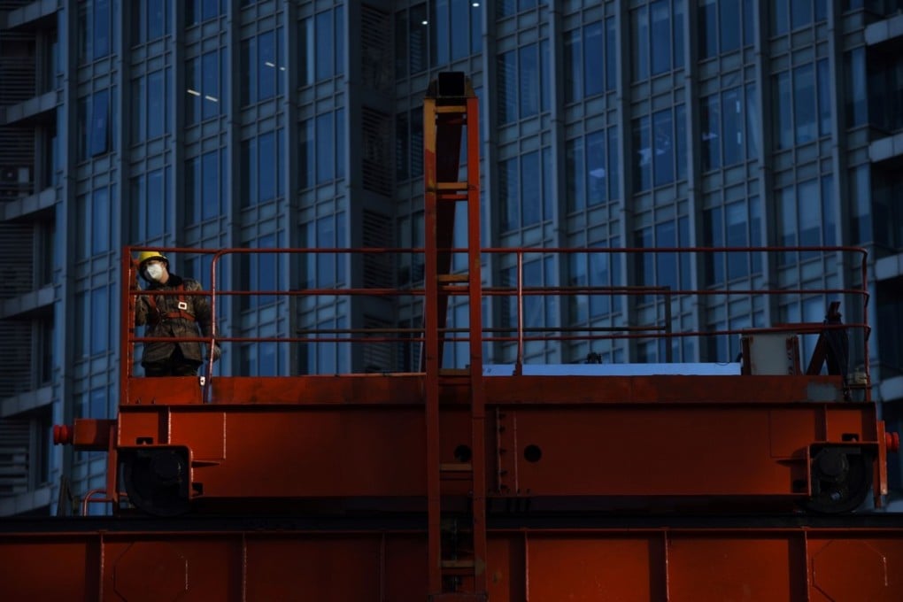 A construction worker in Beijing. Though infrastructure investment in China has been increasing as a share of total investment since 2012, it has already reached such a high level that continued growth could worsen resource allocation. Photo: AFP