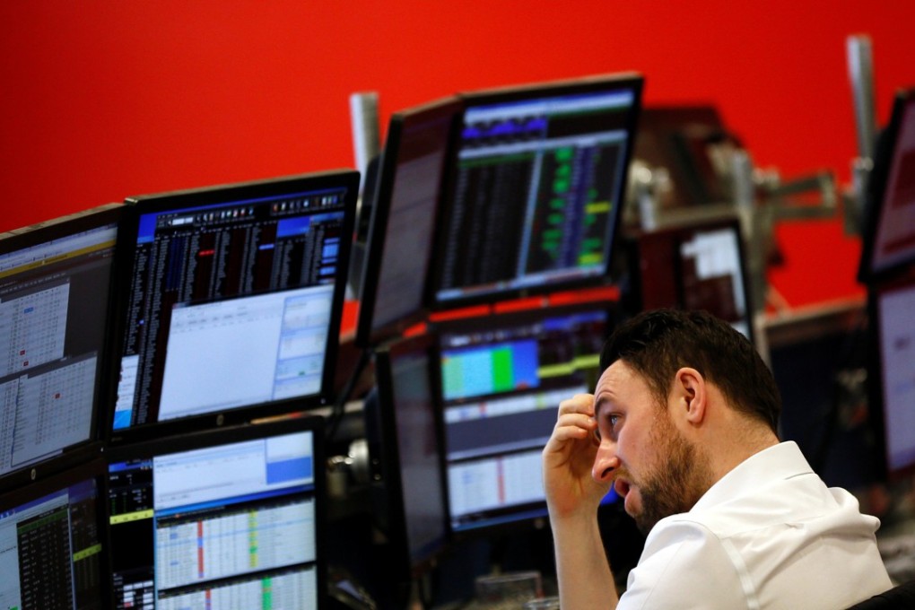 A market maker works on the trading floor at IG Index in London on January 14, 2016. Photo: REUTERS