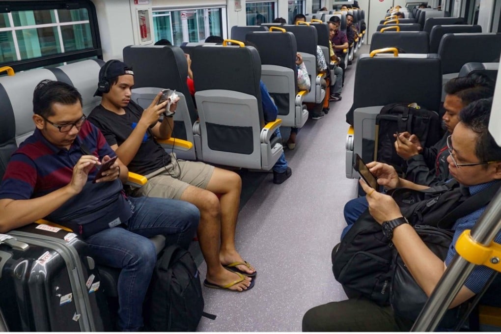 Passengers on the newly launched airport train in Tangerang, on the outskirts of Jakarta. Photo: AFP