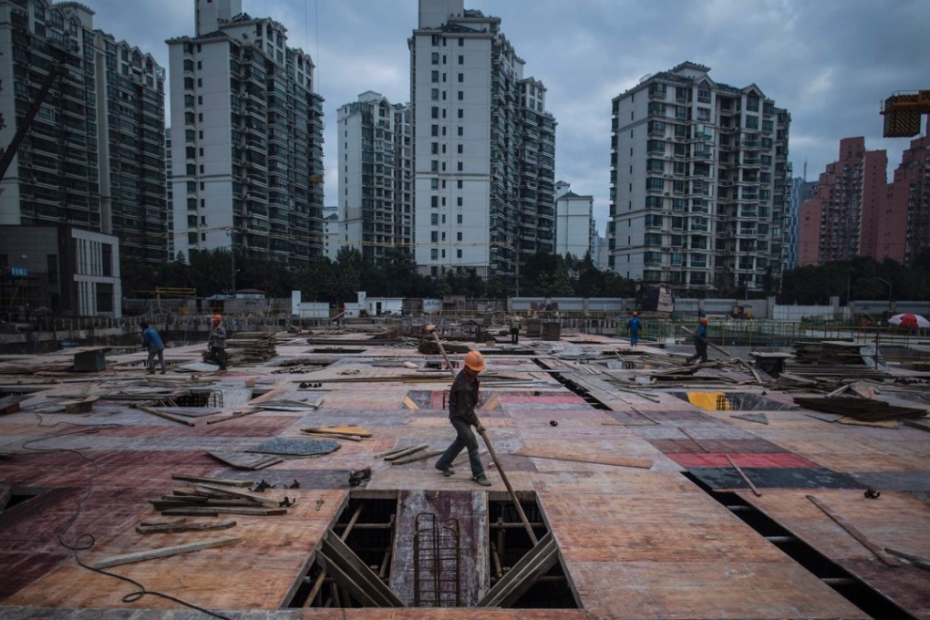 A residential skyscraper construction site in Shanghai. Finding an affordable home has become a serious crisis in the city, and the government has now promised to grant more licences to developers to build rent-only flats. Photo: AFP