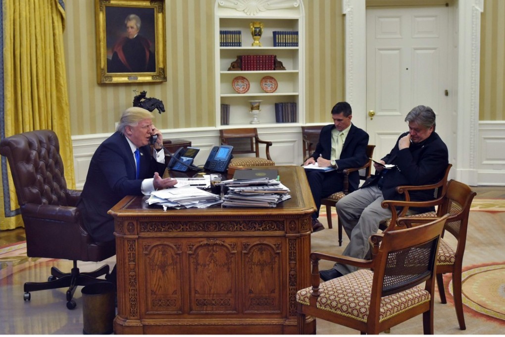 Donald Trump with Steve Bannon (right) and Michael Flynn in the Oval Office. Photo: AFP