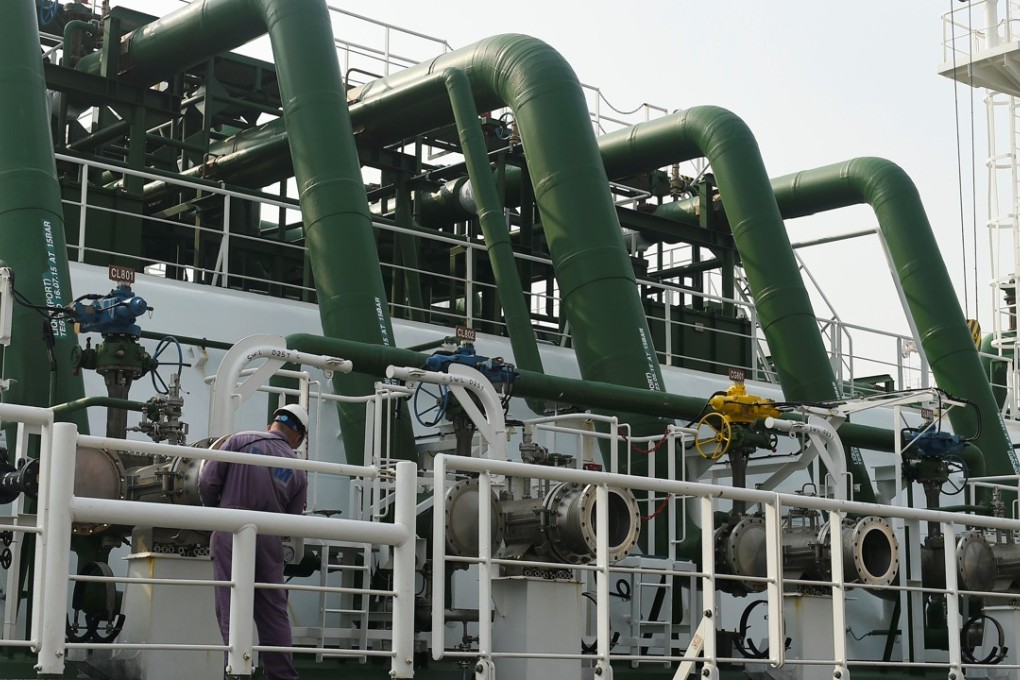 A worker works on a LNG tanker at a port in Tianjin in northern China. The country’s has become the world’s second biggest buyer of shipped natural gas. Photo: Reuters