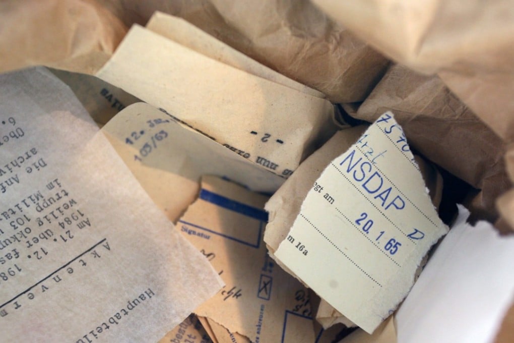 Torn up Stasi documents are seen at the education centre of the Federal Office for the Stasi Archives in Berlin. Photo: EPA