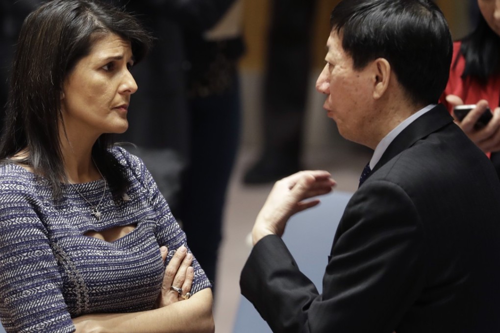 Awkward conversation: US ambassador to the UN Nikki Haley and Chinese deputy ambassador Wu Haitao. Photo: AP