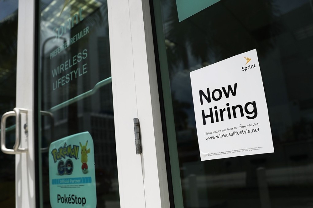 A now-hiring sign is posted in a window of a business in Miami, Florida. Hiring by private US firms surged in December far more than expected, with nearly all of the gain concentrated in the services sector. Photo: AFP