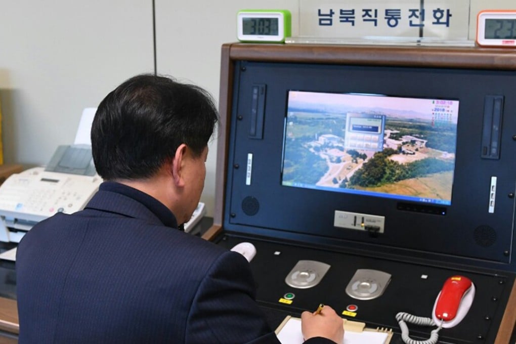 A South Korean government official checks the direct communications hotline to talk with the North Korean side in the border village of Panmunjeom on Wednesday. Photo: Yonhap via AP