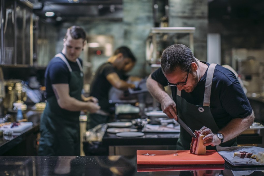 Australian chef Clayton Wells at work in the kitchen of his Singapore restaurant Blackwattle. Photo: Nikki Toh
