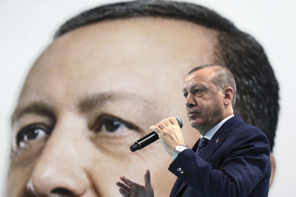 Turkey’s President and leader of ruling Justice and Development Party Recep Tayyip Erdogan addresses his supporters in Duzce, Turkey, on New Year’s Eve. Photo: AP