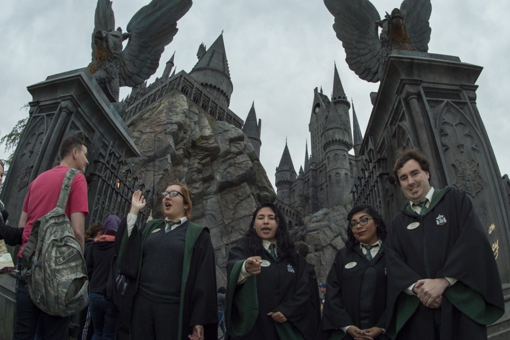 Fans enter Hogsmeade at the Grand Opening of the "Wizarding World of Harry Potter" at Universal Studios Hollywood. China is removing a 49 per cent foreign investment cap on entertainment venues in Beijing. Photo: AFP