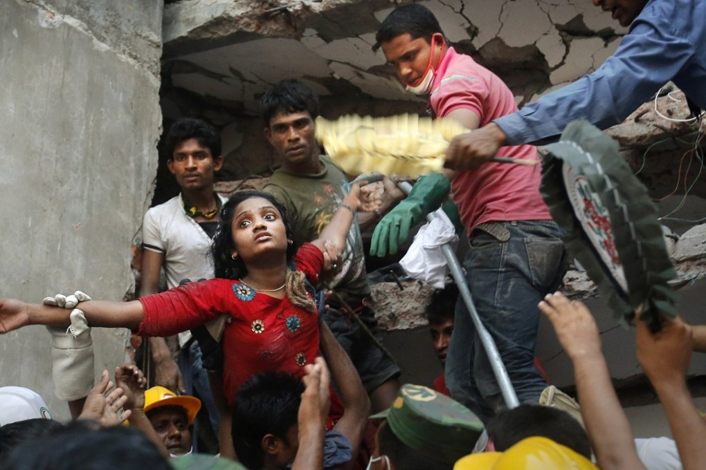 A survivor is lifted out of the rubble by rescuers after the collapse of the Rana Plaza building near Dhaka, Bangladesh,in April 2013. Photo: AP