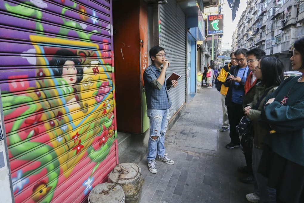 Stewart Cheng takes a small group out on his first art tour. Photo: Dickson Lee