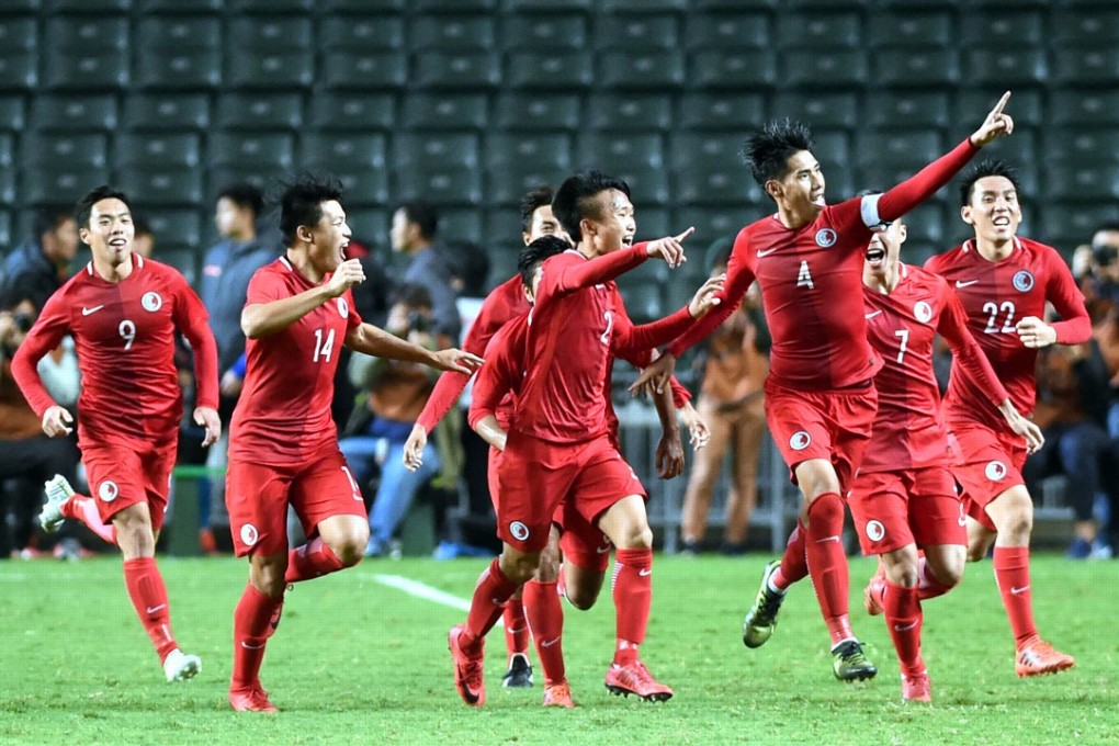 Hong Kong captain Cheung Chi-yung (third from right) celebrates with his teammates after scoring the opening goal in the 2-0 victory against Guangdong. Photos: Xinhua