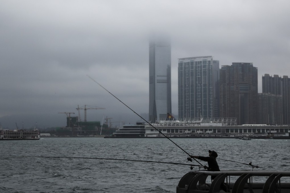 Heavy fog is seen at Victoria Harbour from Central. Photo: Edward Wong