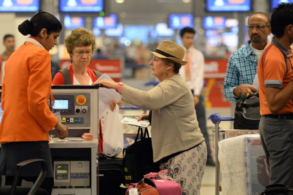 Passengers at Indira Gandhi International airport in New Delhi. Photo: AFP